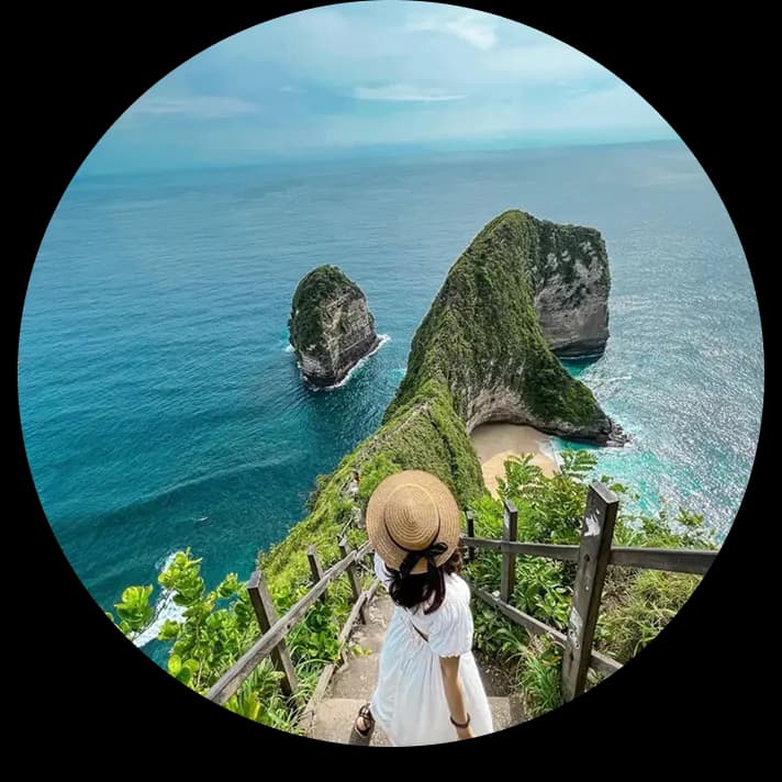 Traveller on a clifftop path above the sea in Bali